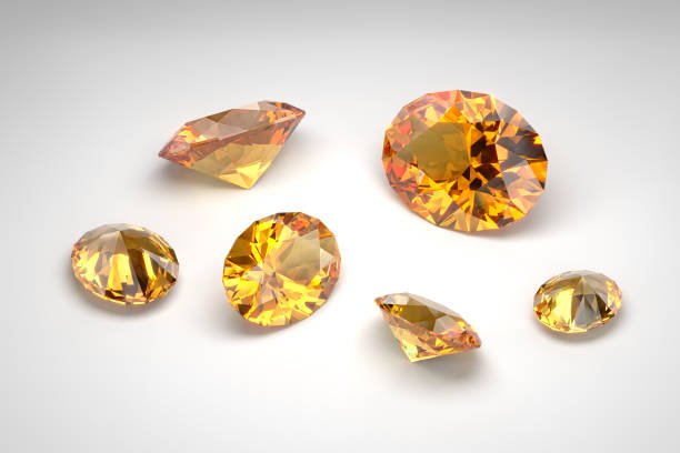 Scattering of topazes of different sizes on the white background. Exhibition of precious stones. Cut in oval style. 3d rendering.