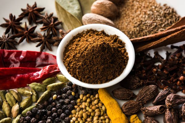 Colourful spices for Garam Masala. Food ingredients for garam masala, indian spice mix with Powder. Selective focus